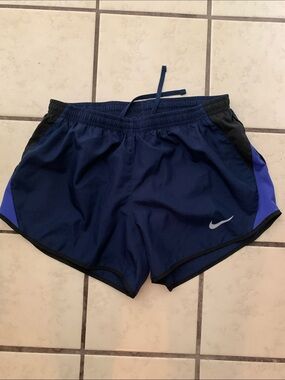 Nike Women's Dark Blue Athletic Shorts with Black Trim and Purple Panels